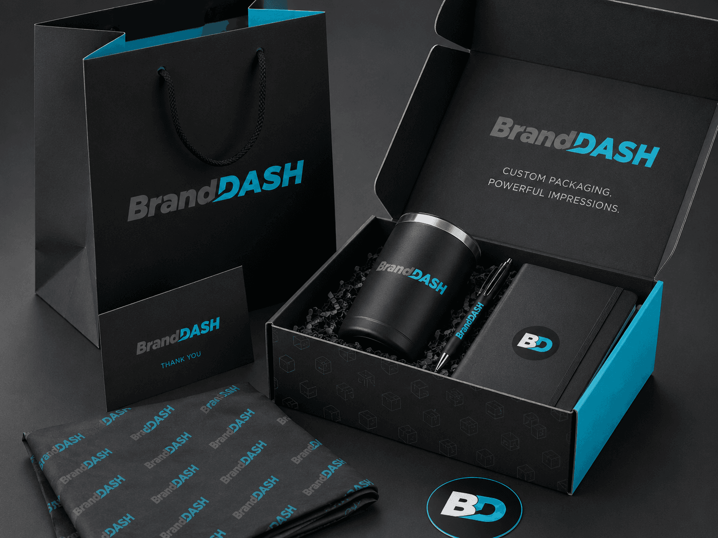 BrandDash corporate gift box with tumbler, pen, notebook, bag, and branded tissue